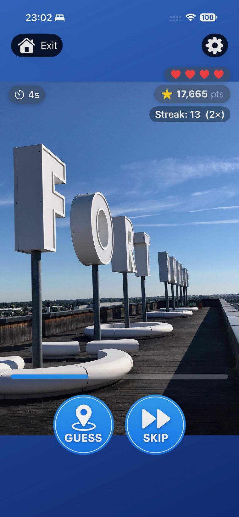 Zoom Quest gameplay — a rooftop letter sculpture with a 13-round streak